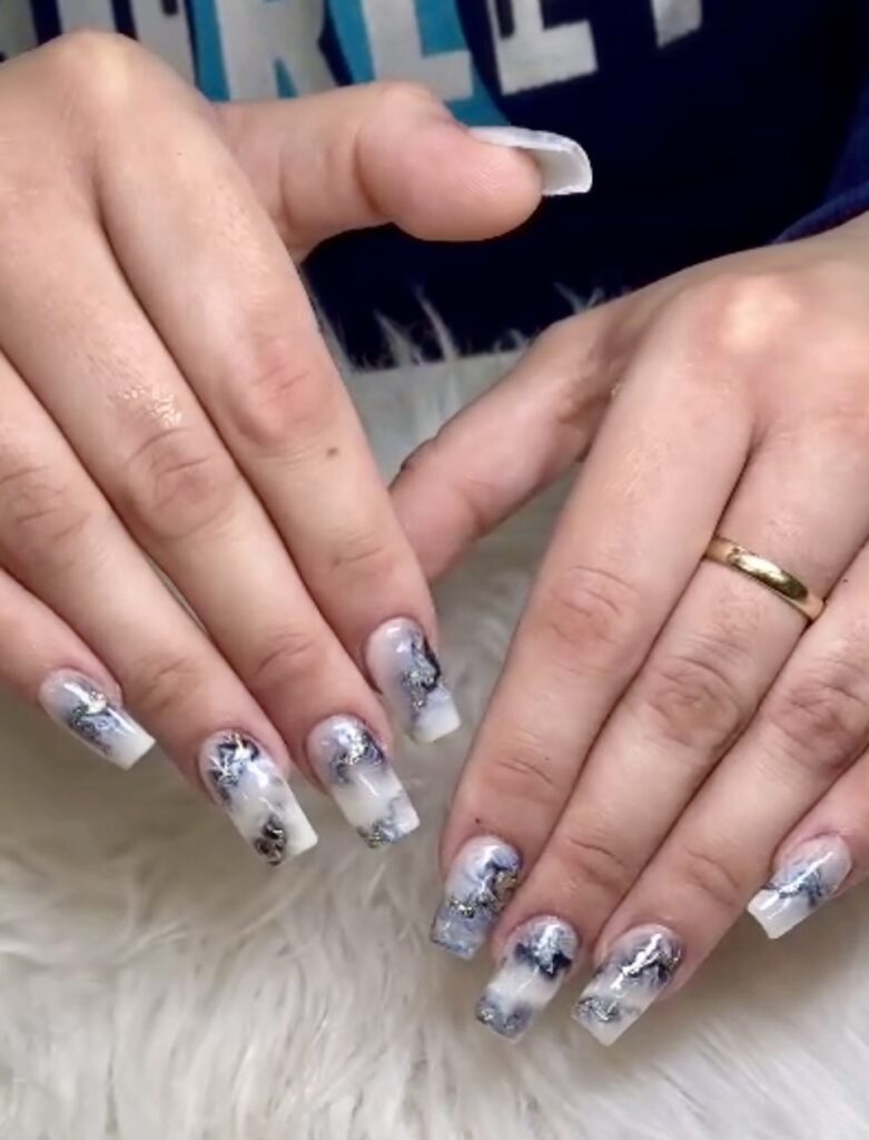 Pastel floral nail art design with gold accents at Eternal Nails London Ontario